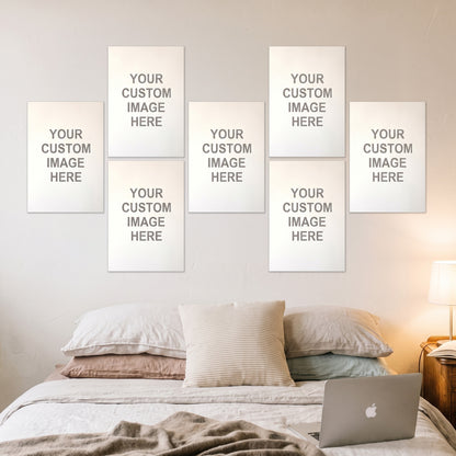 7 posters at 13x19 inches on a wall above a desk
