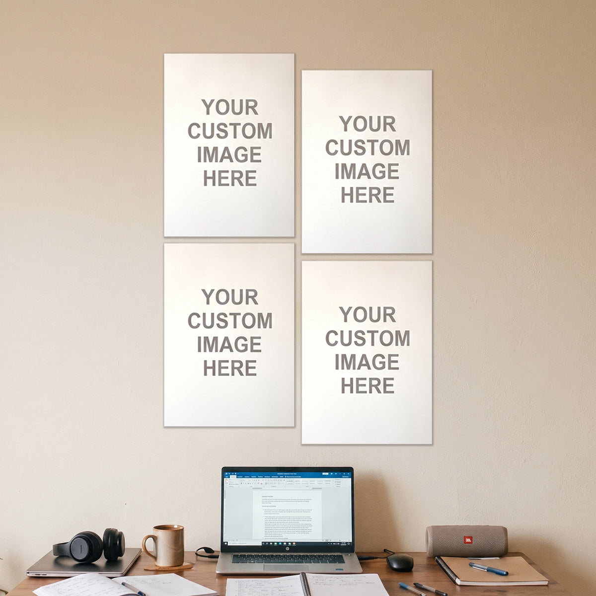 4 A3 posters on a wall above a desk