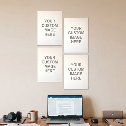4 A4 posters on a wall above a desk