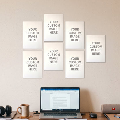 7 A5 posters on a wall above a desk